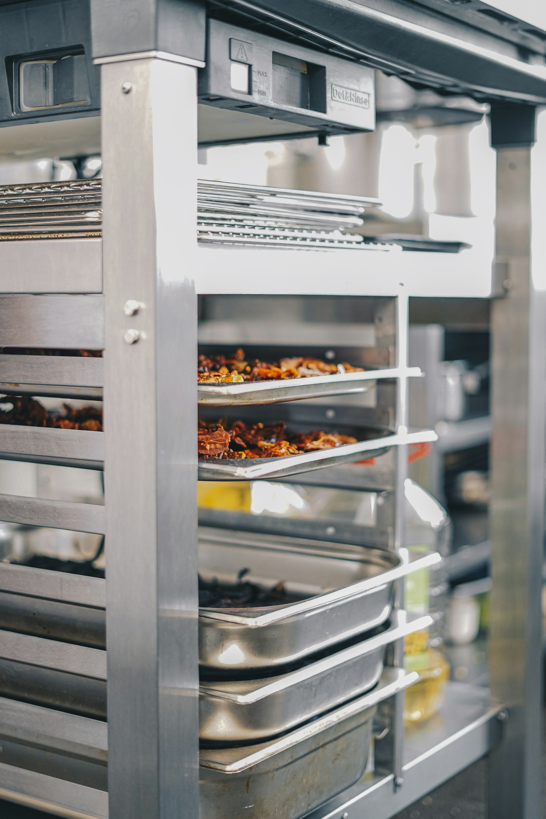 Interior racks of a commercial oven with baking trays
